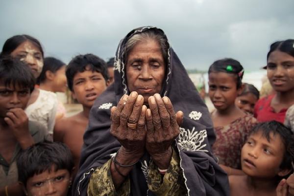 Hundreds march in Yangon over official label for Muslim minority